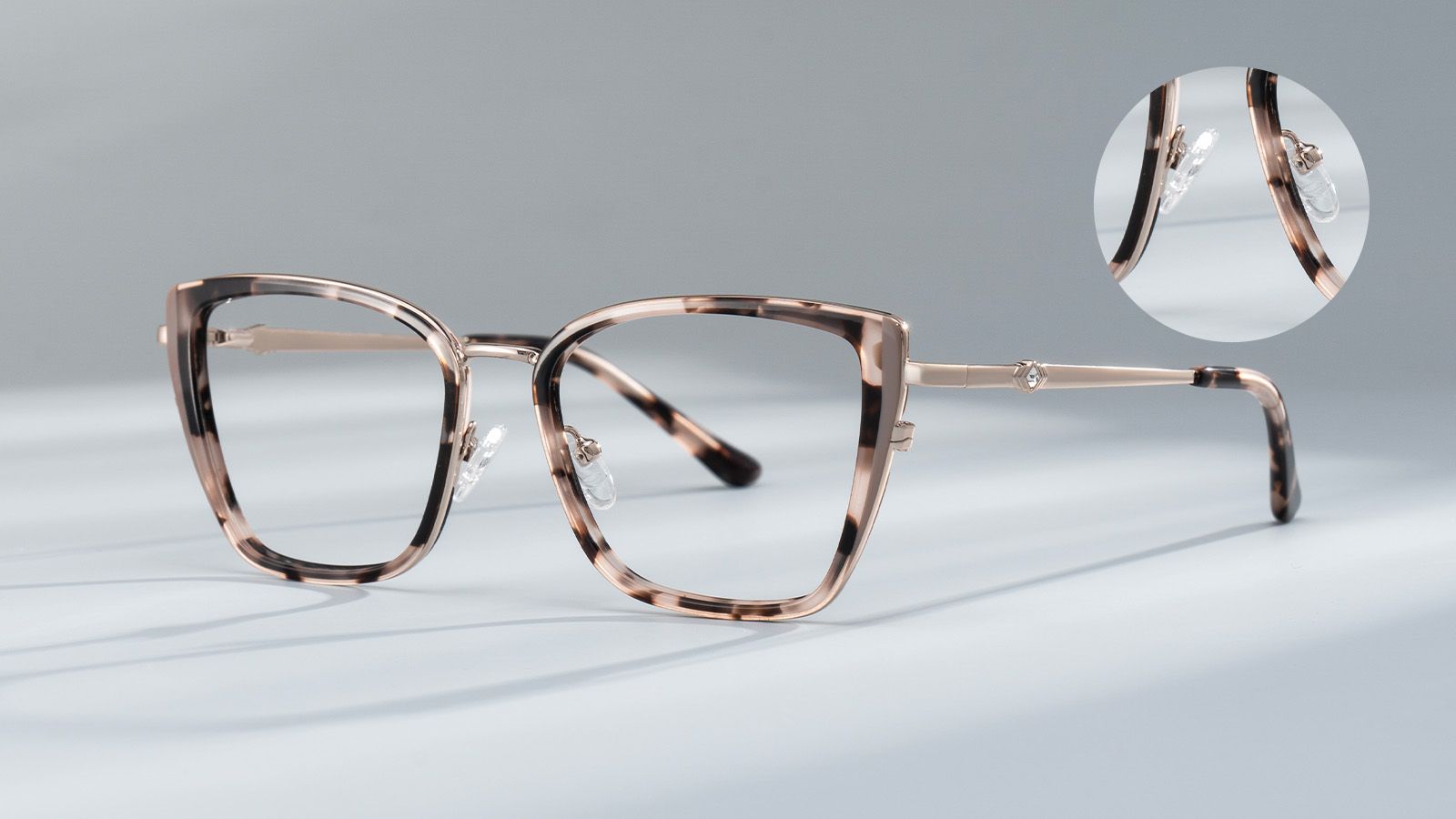 Eyeglass frames with a closeup on the adjustable nose pads that help prevent fog.